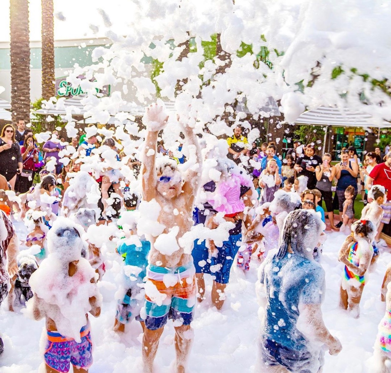 A large community foam party on the Space Coast
